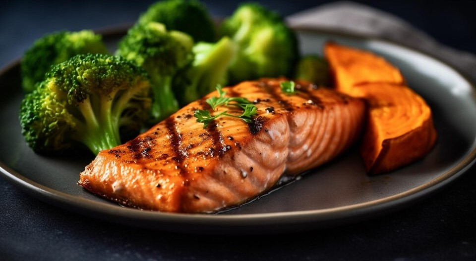 A beautifully grilled salmon fillet with a side of fresh vegetables.