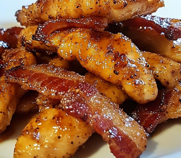 "Beef Bacon Brown Sugar Chicken Tenders with caramelized brown sugar glaze on a white plate