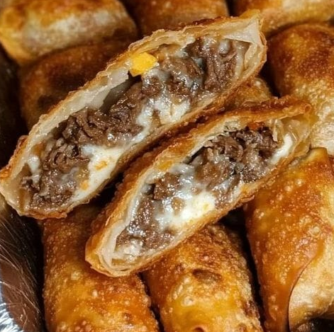 Crispy Philly Cheesesteak Egg Rolls filled with beef and cheese