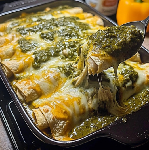 Cheesy chicken enchiladas with green sauce, topped with melted cheese and served fresh from the oven