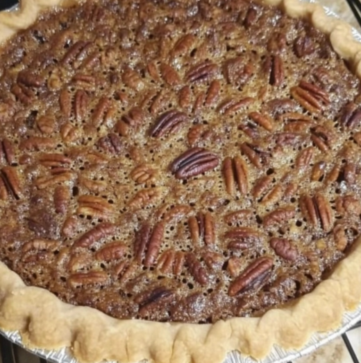 Old-Fashioned Homemade Pecan Pie with a flaky crust and rich pecan filling, cooling on a rack