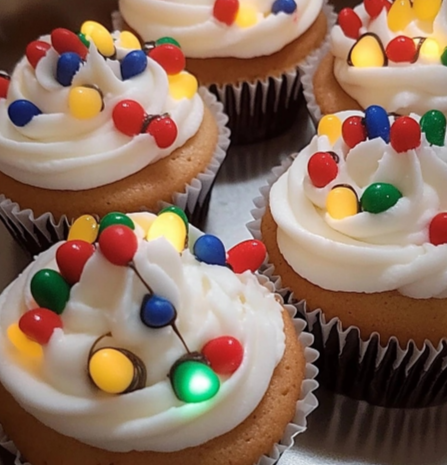 Christmas Light Cupcakes decorated with black icing and colorful candy lights