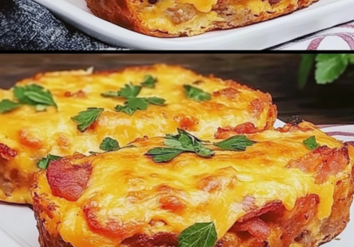 Cheesy Bacon and Sausage Breakfast Bake served on a white plate with golden cheese