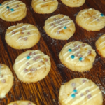 Classic Sprinkle Shortbread Cookies Recipe – Buttery cookies topped with colorful sprinkles on a wooden table.